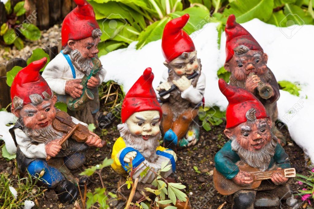 10975897-many-garden-gnomes-in-a-garden-kitsch-is-fun