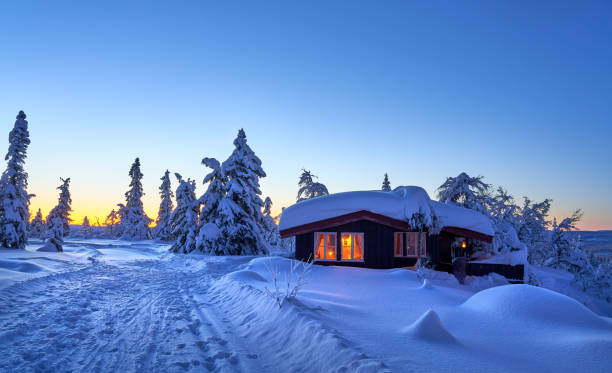 Simple cabin after heavy snowfall in the Norwegian mountains.